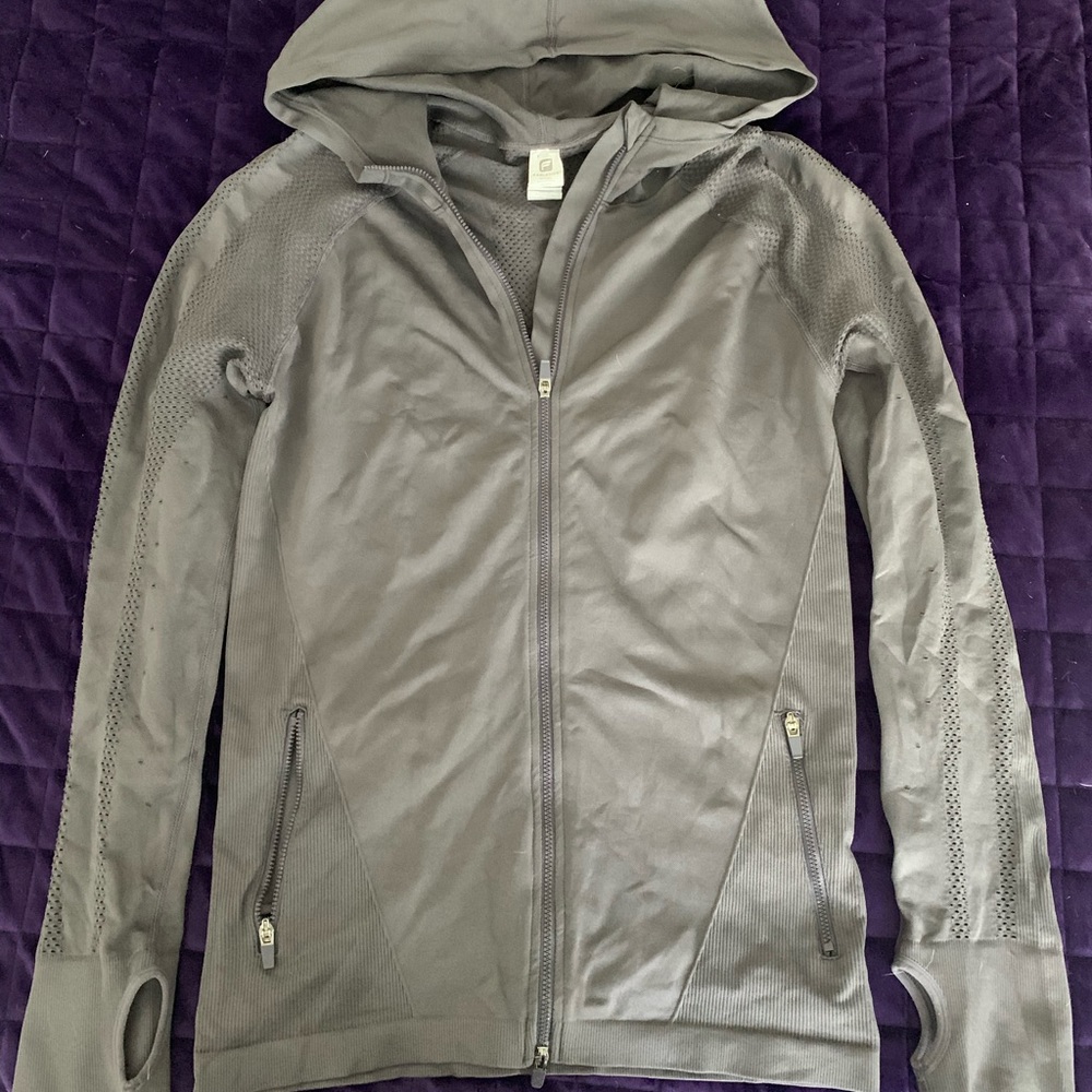 Fabletics activewear jacket with thumbholes.